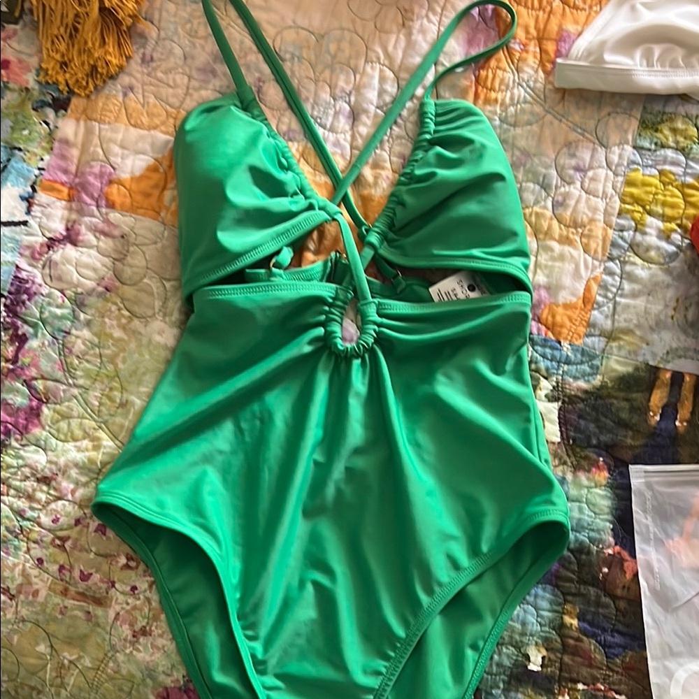 Green cheeky one piece swimsuit with cutout